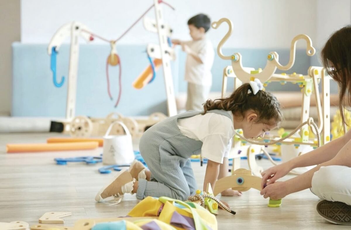Children playing with Rigamajig Junior in a playspace
